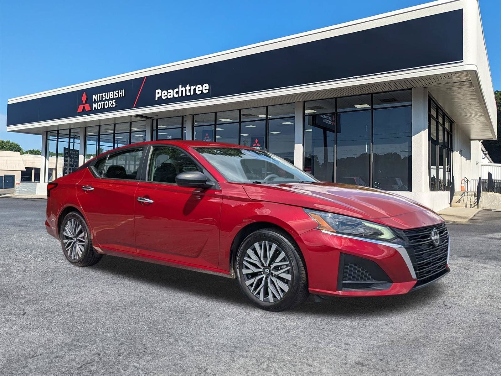 2024 Nissan Altima 2.5 SV in Scarlet Ember — front three-quarter view