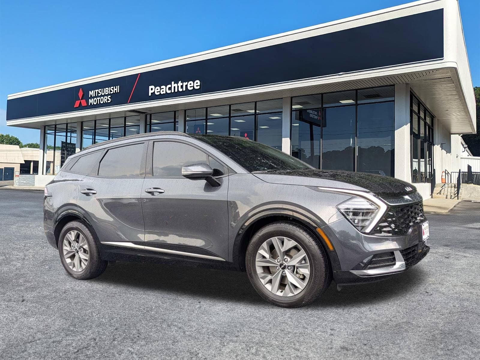 2024 Kia Sportage SX in Gravity Gray — front three-quarter view