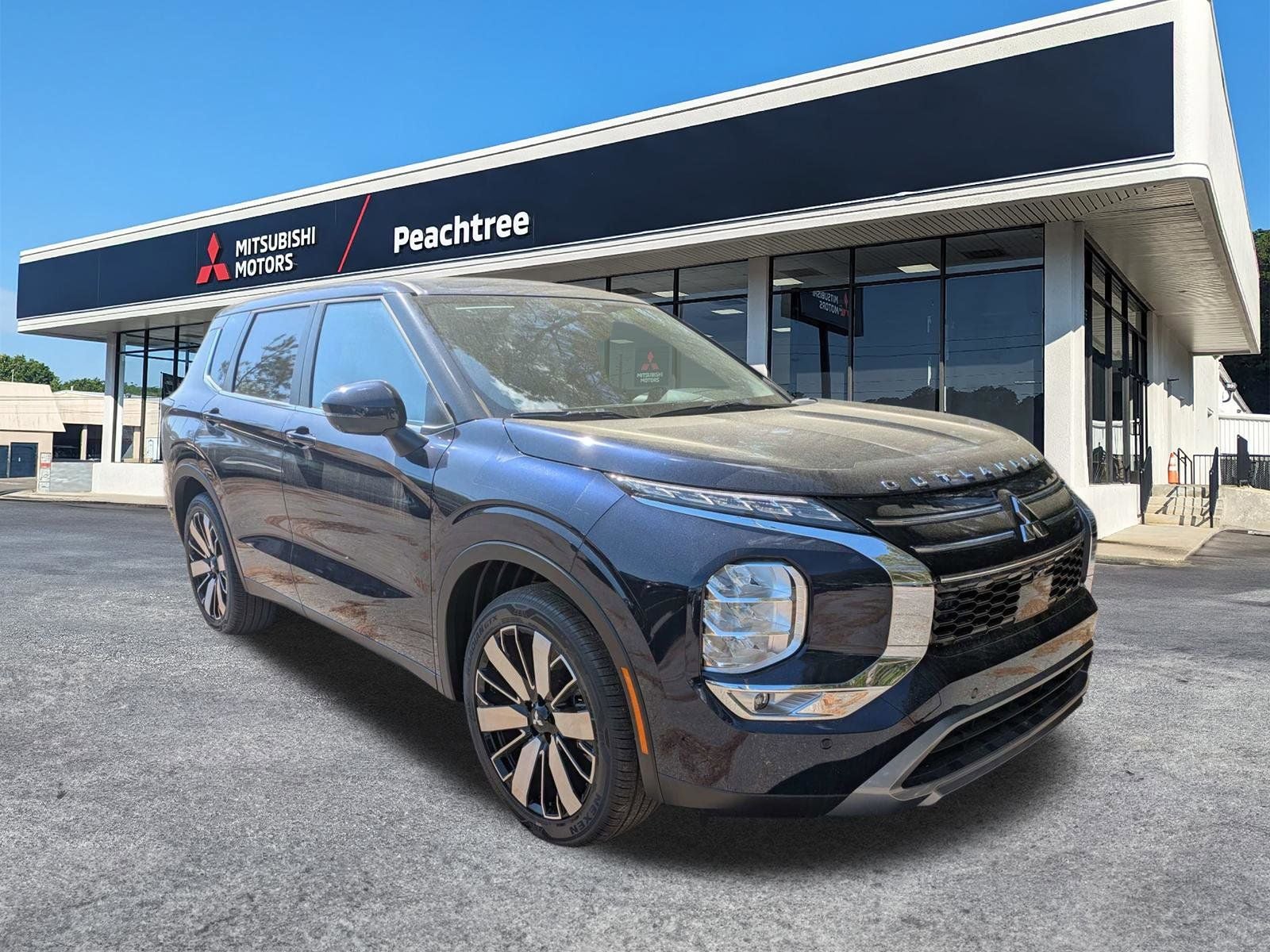 2026 Mitsubishi Outlander SE in Blue — front three-quarter view