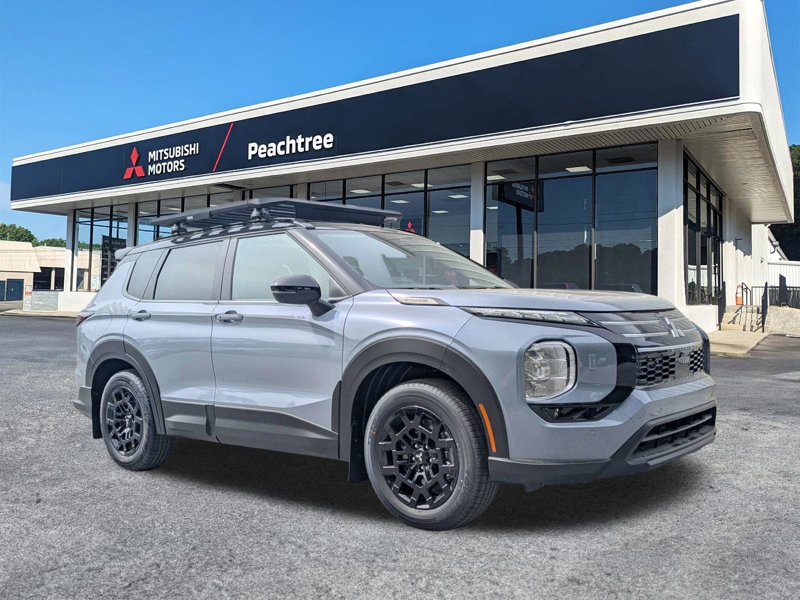 2026 Mitsubishi Outlander Trail Edition in Moonstone Gray/Black Roof — front three-quarter view