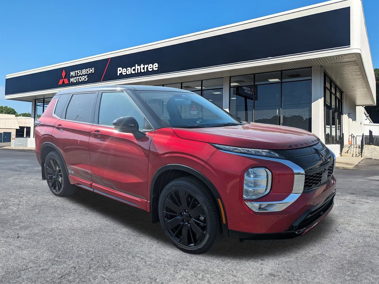 2026 Mitsubishi Outlander Ralliart in Red Diamond/Black Roof — front three-quarter view