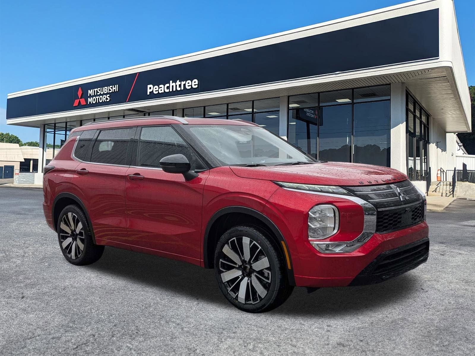 2025 Mitsubishi Outlander SEL in Red Diamond — front three-quarter view